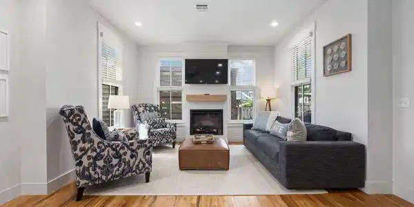 Image 3: Living room with wood finished floors, baseboards,