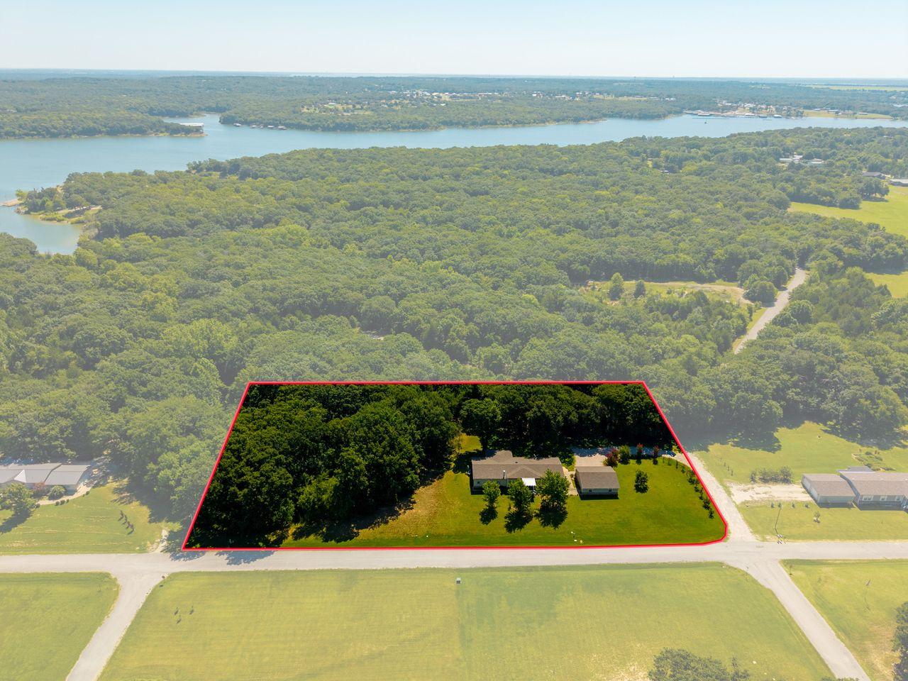 Image 2: Aerial property overview highlighting a residentia