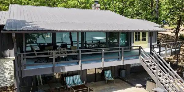 Image 3: Multi-level exterior featuring a metal roof, expan