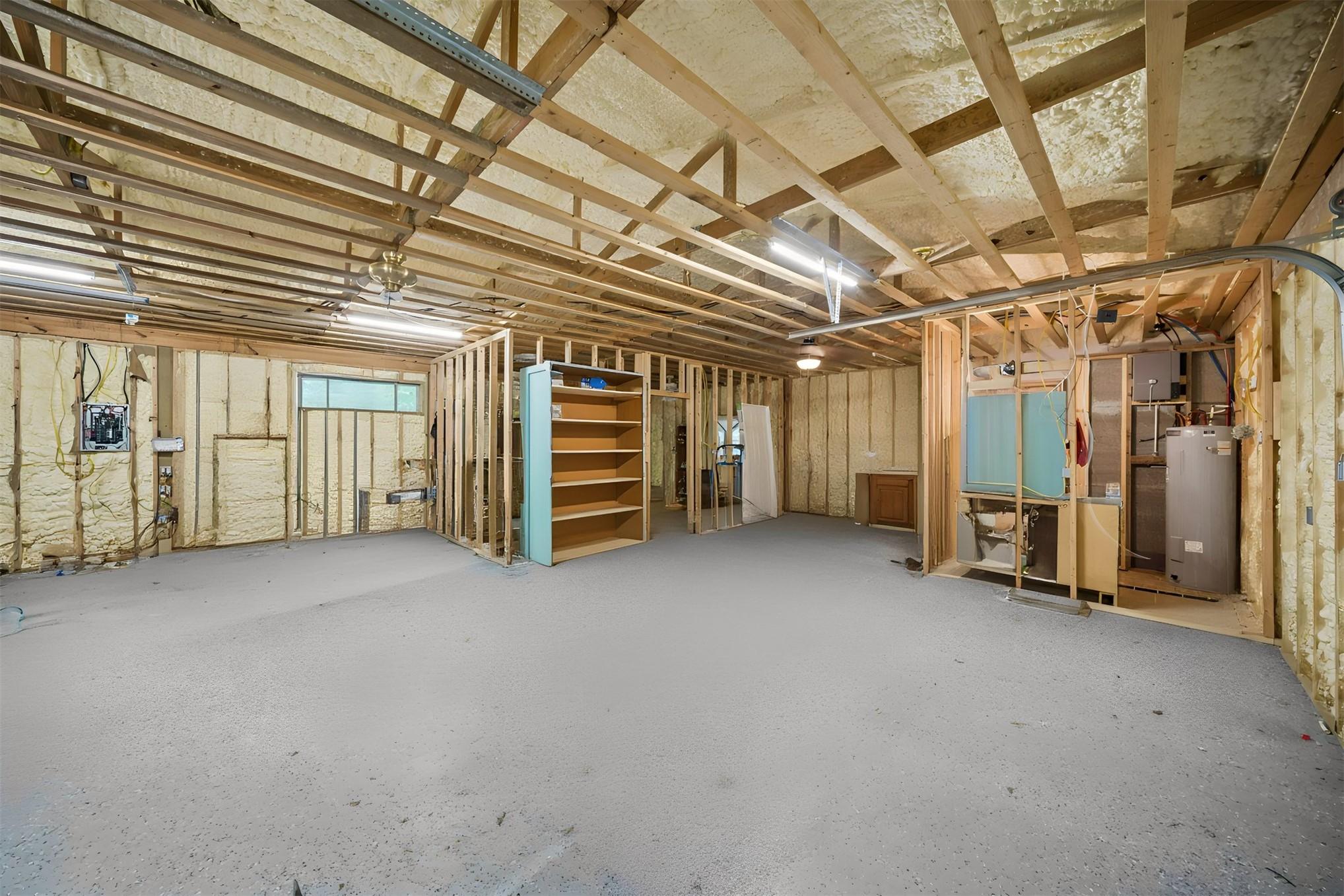 Image 2: Spacious unfinished interior featuring exposed woo