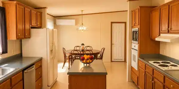 Image 2: Kitchen featuring wood-finish cabinetry, built-in