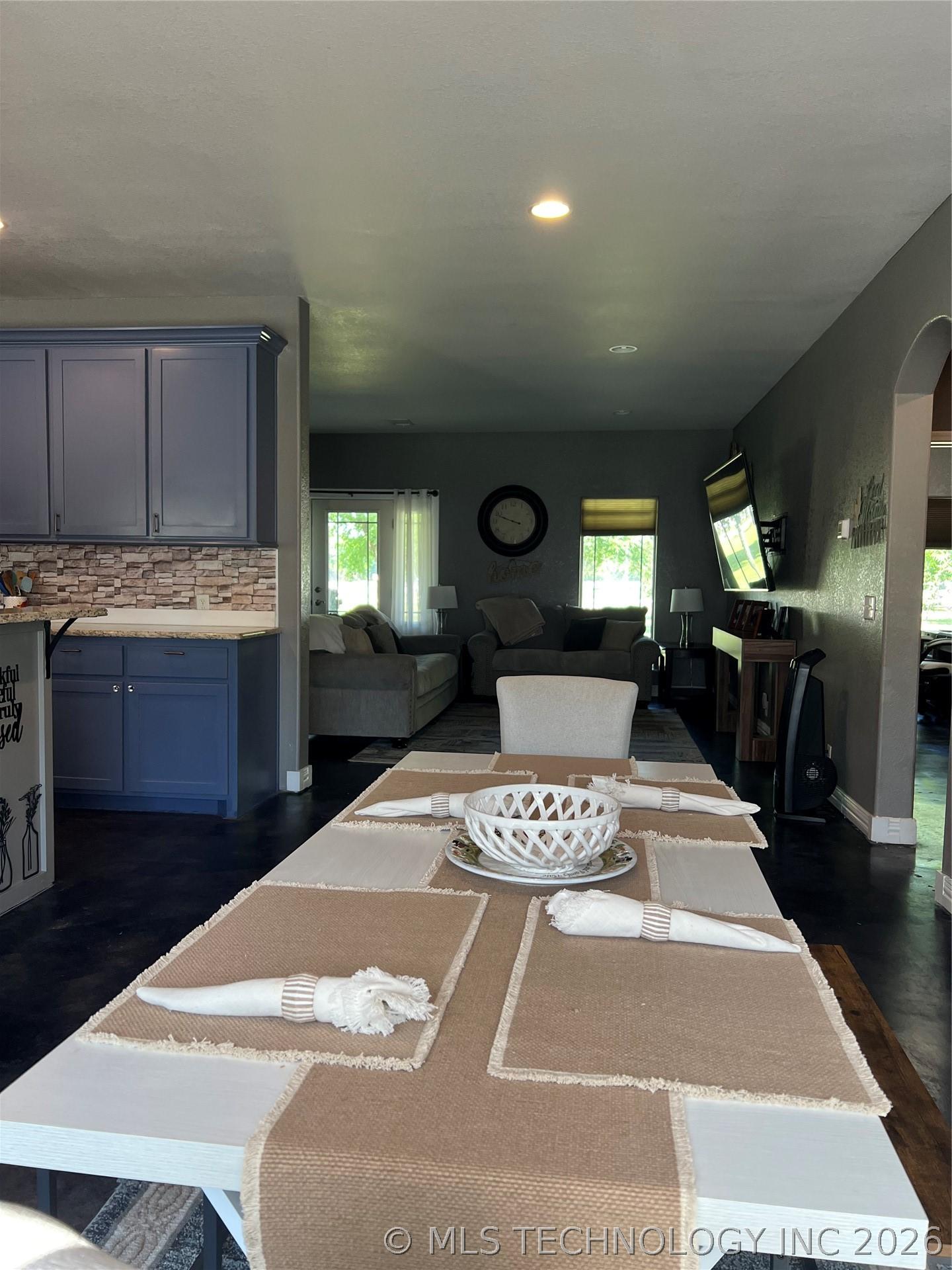 Image 4: Dining area opens into living area with plenty of