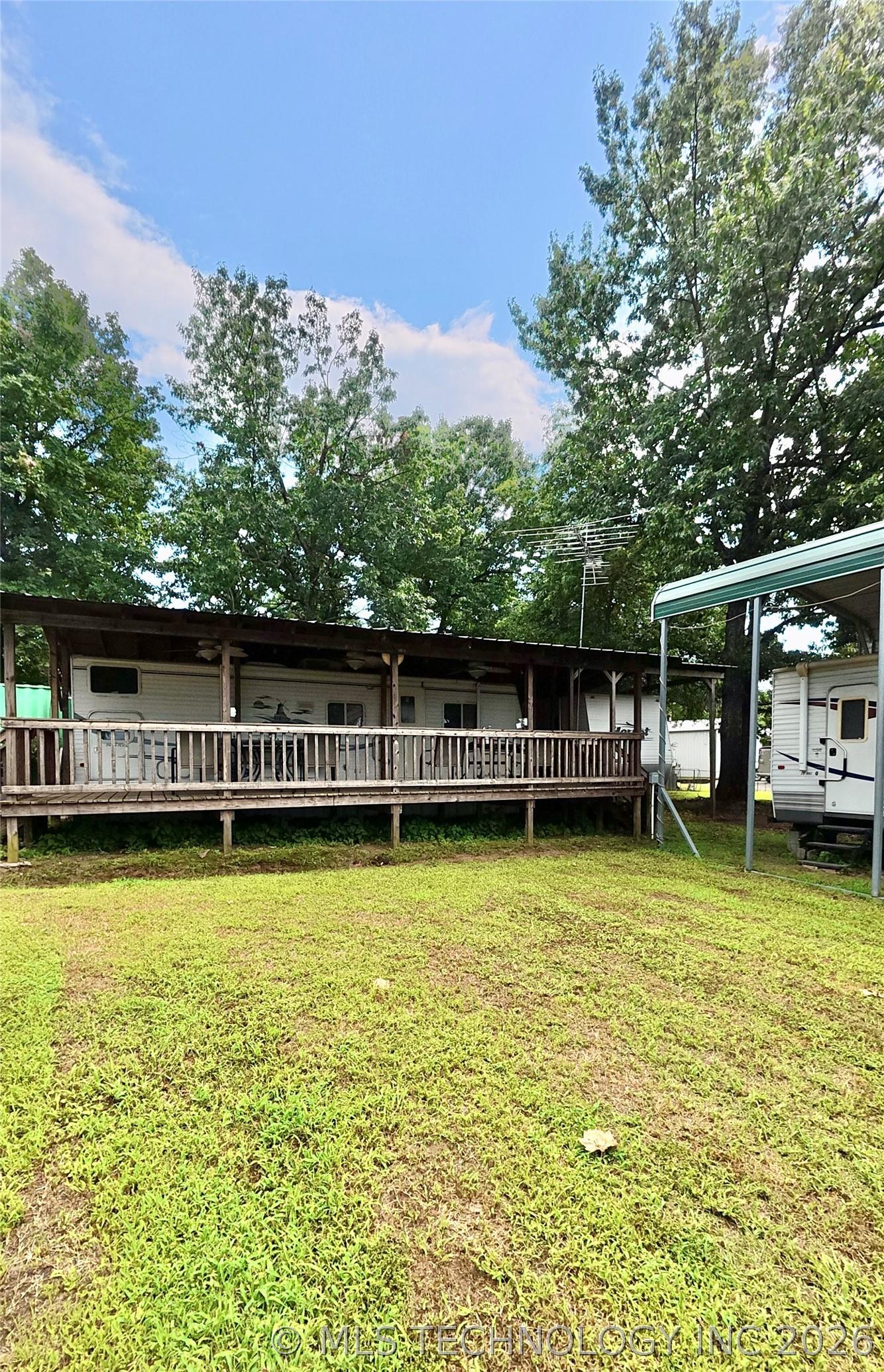 Image 2: Covered deck around both included RV's