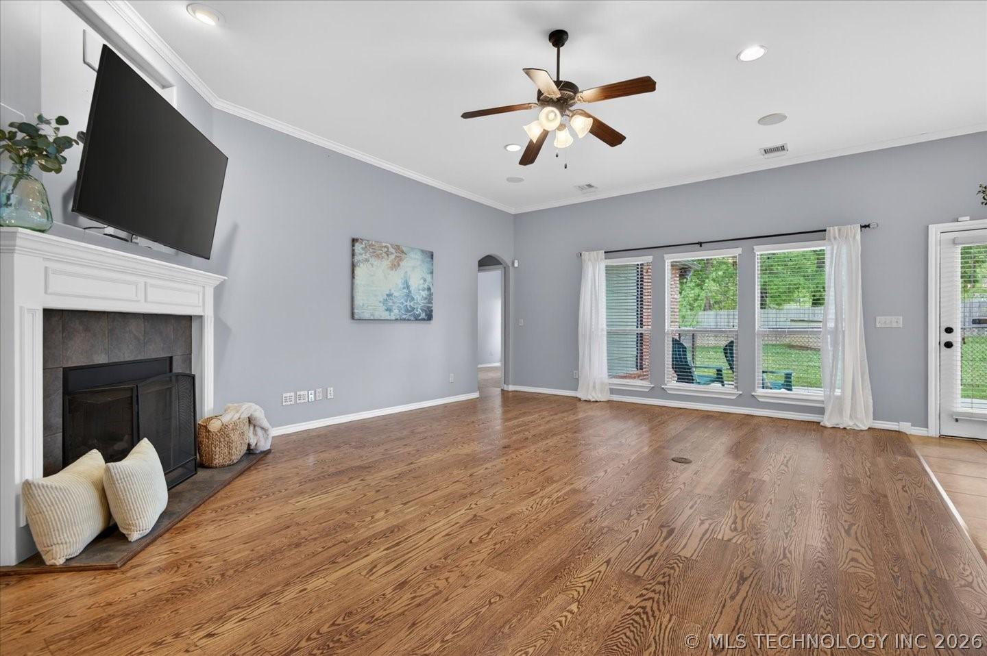 Image 4: Great room with fireplace and high ceilings.