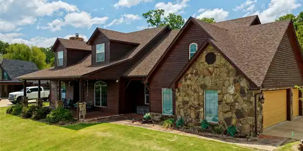 Image 2: Stunning brick and stone residence featuring disti