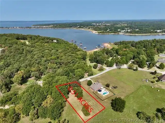 Image 1: aerial view of lot to water