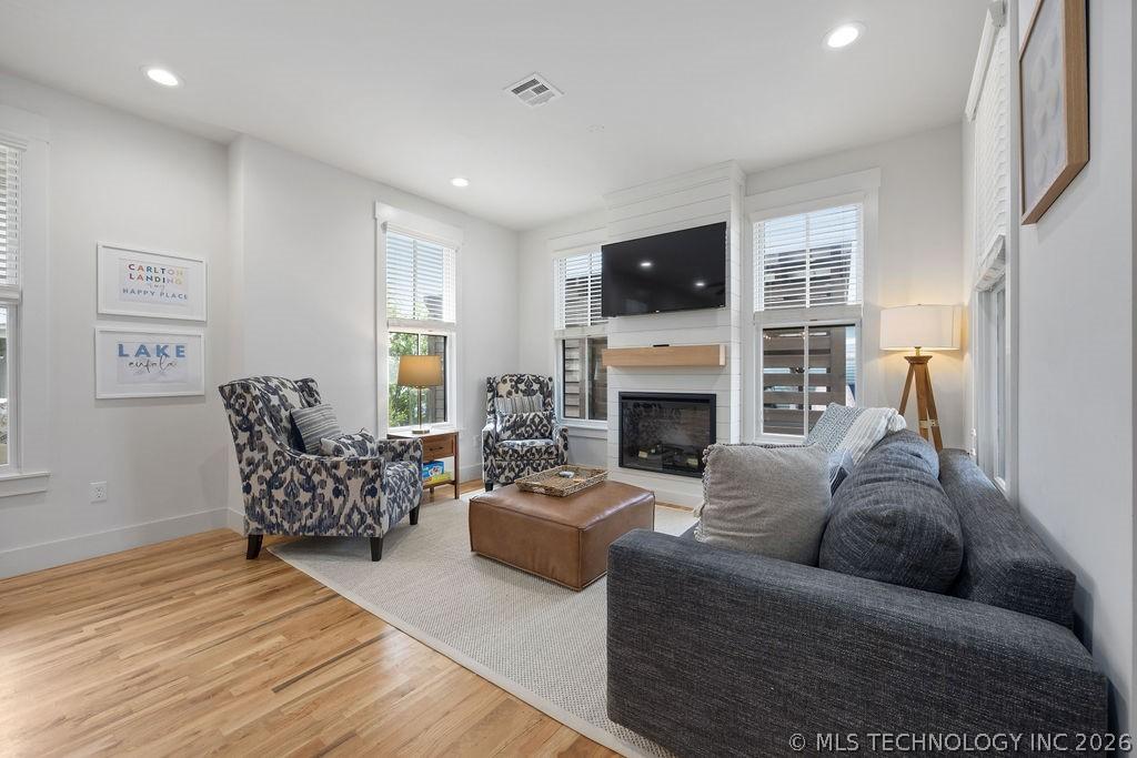 Image 2: Living room with a fireplace, light wood finished