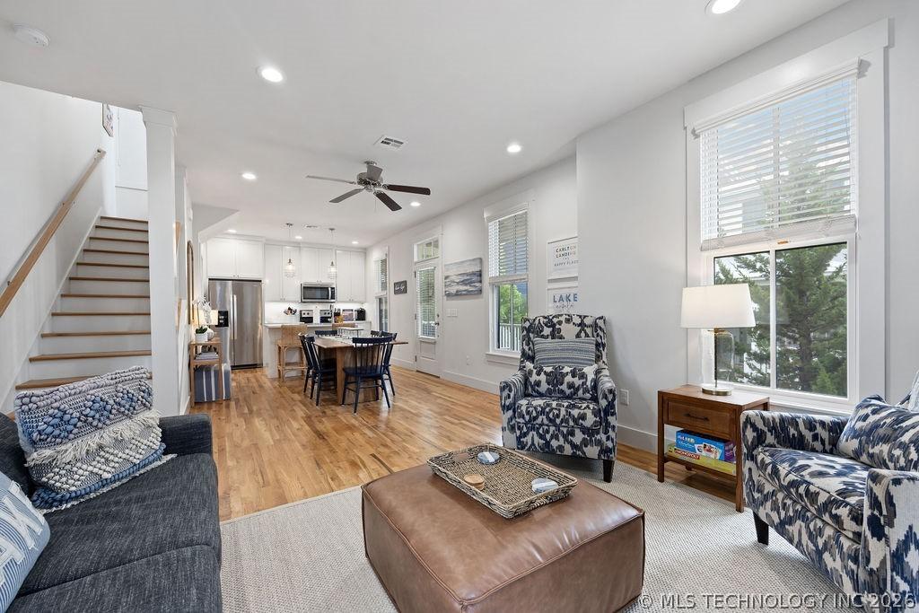 Image 4: Living room featuring stairs, recessed lighting, l
