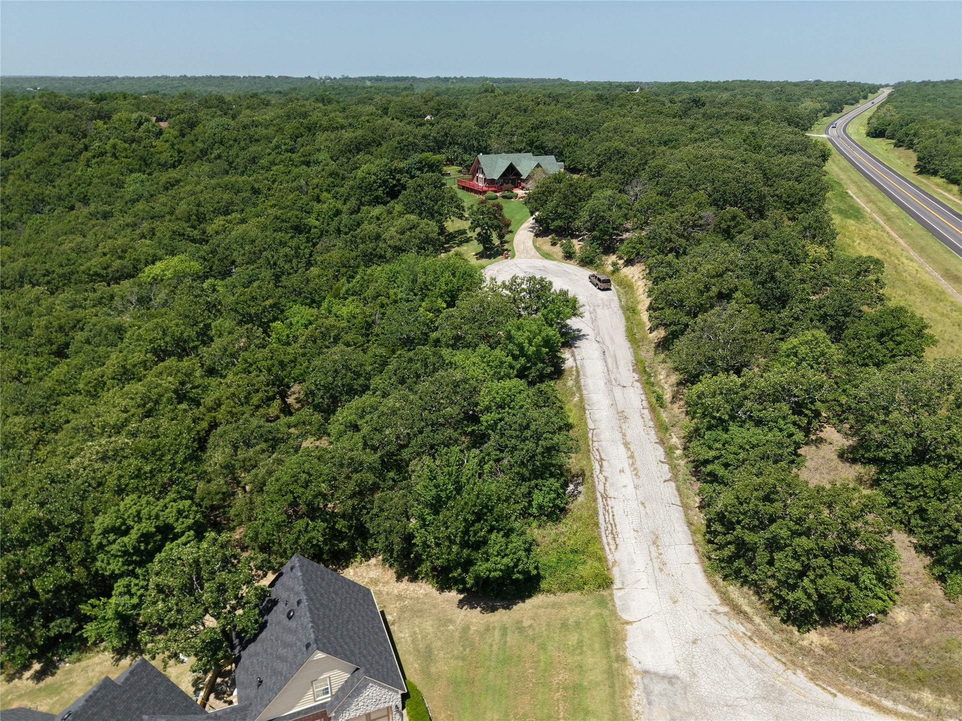 Image 3: Extensive tree coverage surrounding a residential