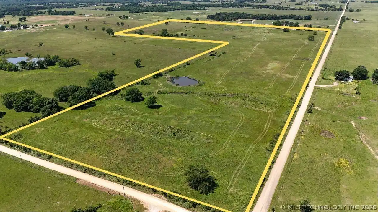Image 1: Expansive undeveloped parcel featuring open fields