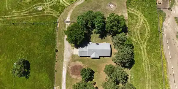 Image 3: Single-story residence with a light-colored metal