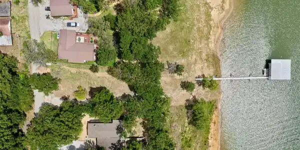 Image 2: Waterfront property featuring a private dock exten