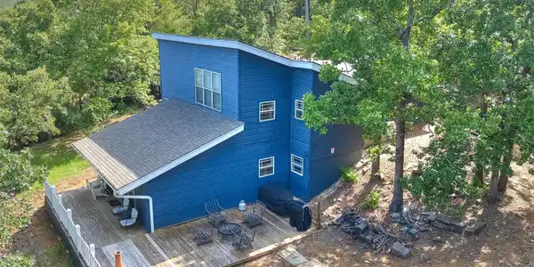 Image 3: Contemporary residence with a striking blue exteri