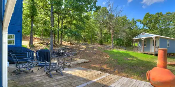 Image 4: Expansive wood deck with a fire pit area, surround
