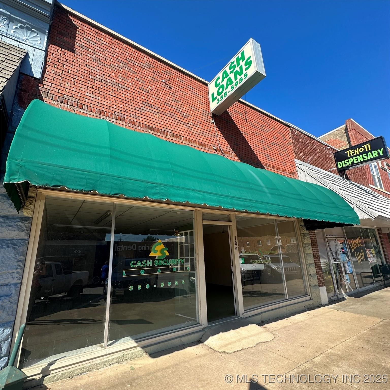 Image 1: awning and sign post