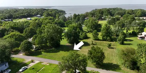 Image 4: Expansive lot featuring mature trees and a substan