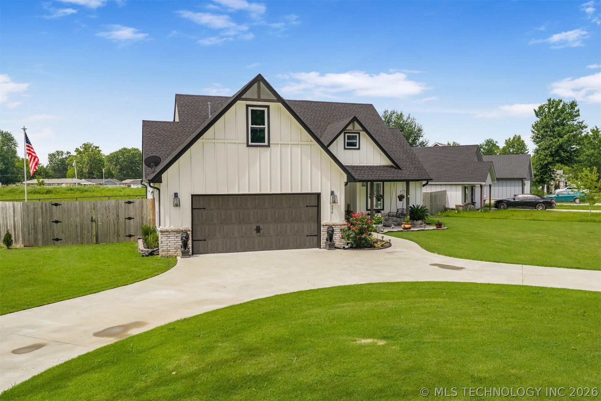Image 2: Front View Showing Landscaping and Front Porch