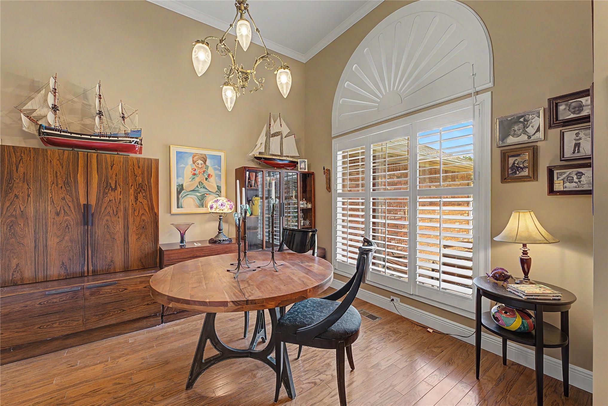 Image 3: Foyer with hardwood flooring, high ceilings, and c