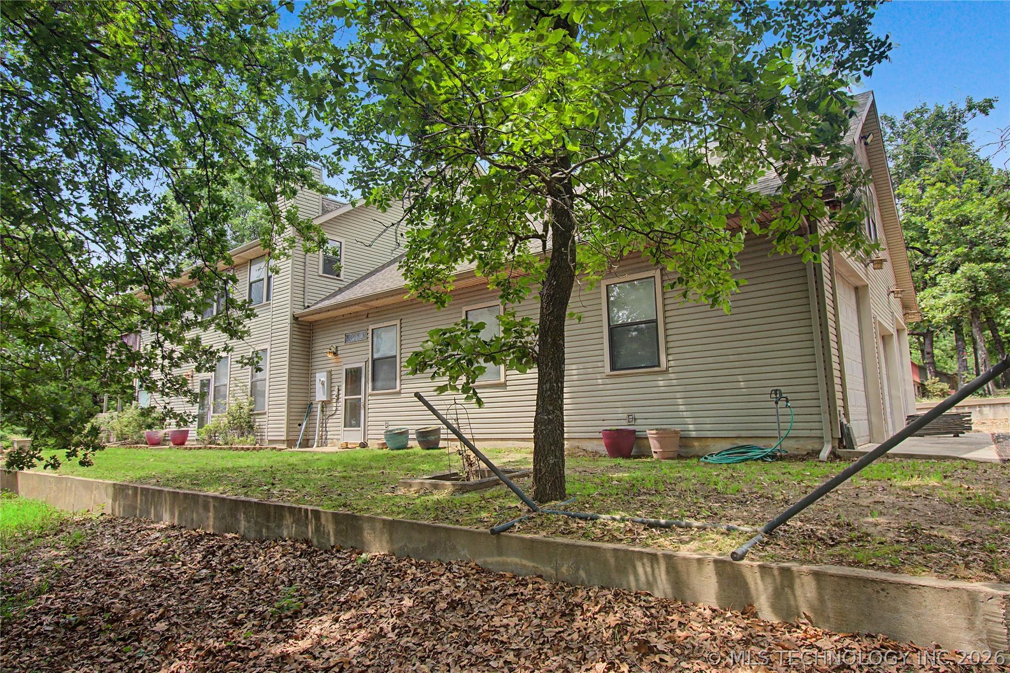 Image 4: Access the home from a very level side yard