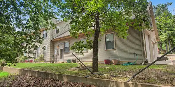 Image 4: Access the home from a very level side yard