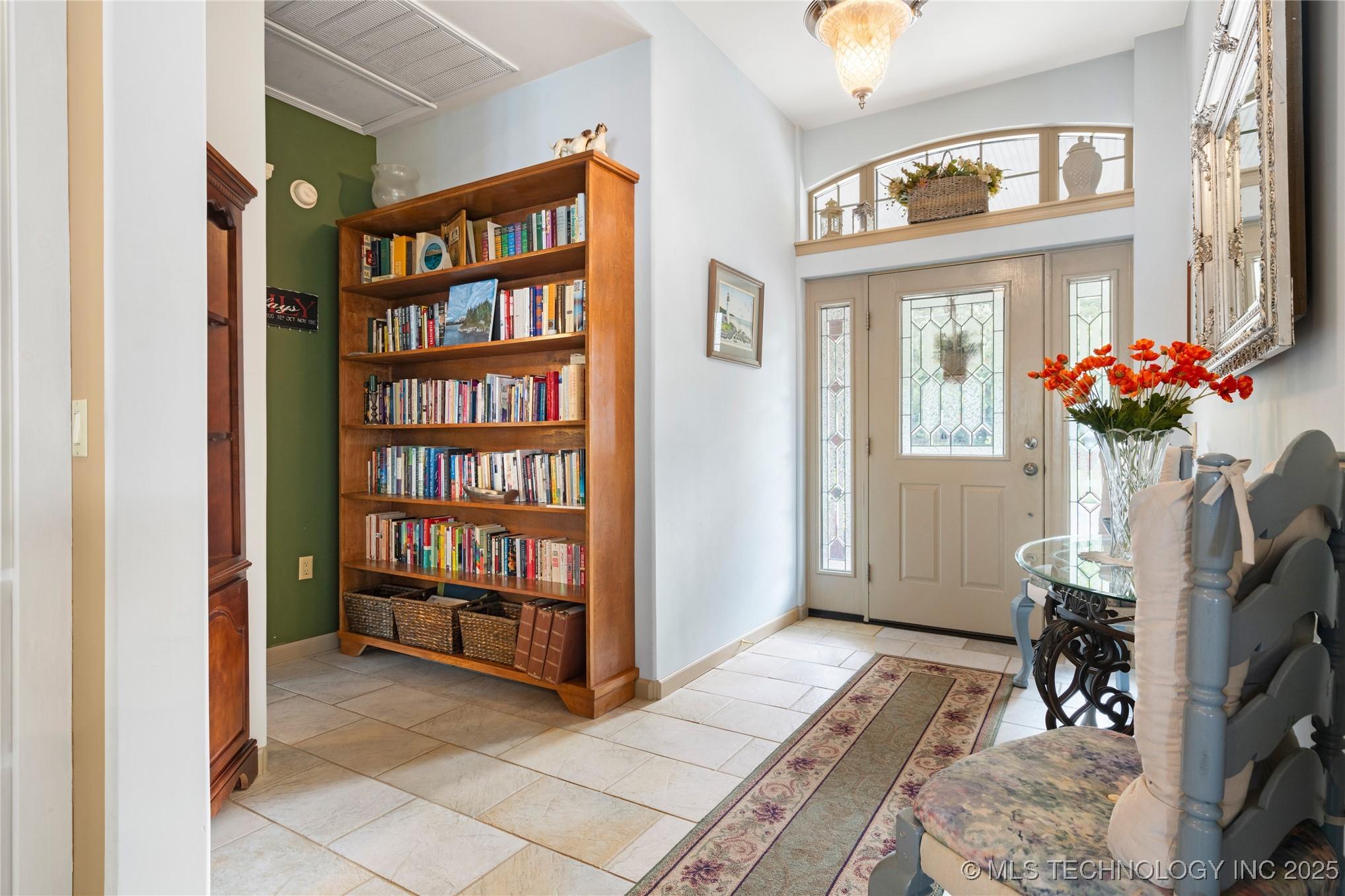Image 3: Beautiful foyer leads to master suite and main liv