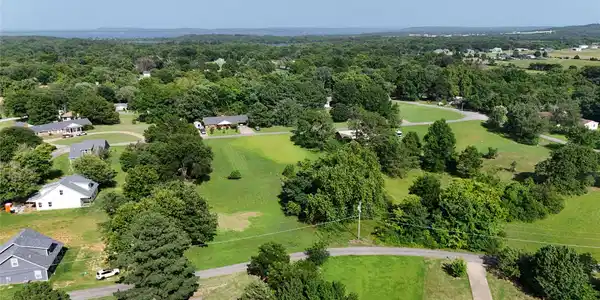 Image 4: Expansive green landscape featuring varied terrain