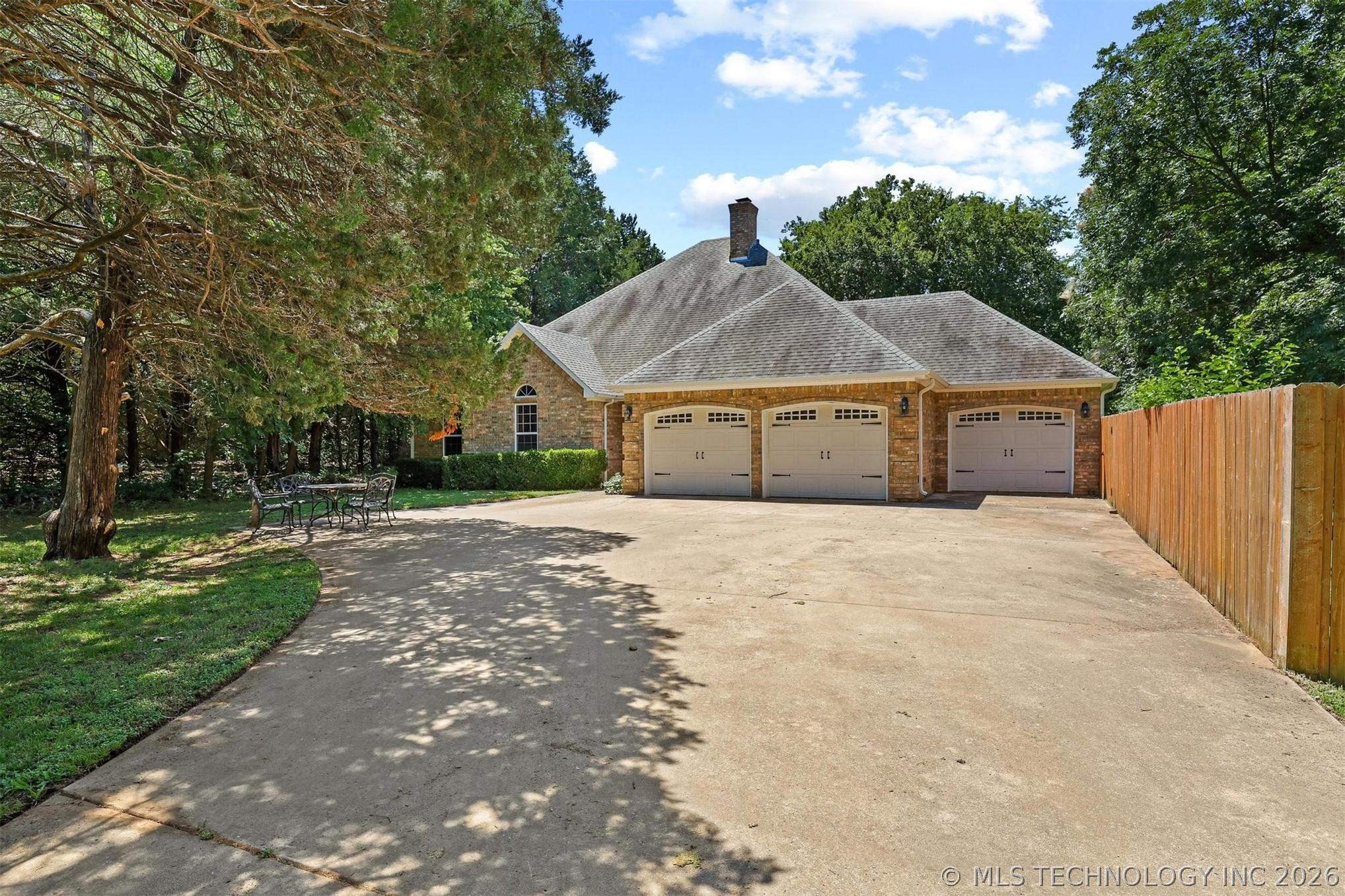 Image 3: Front of house with 3-car garage