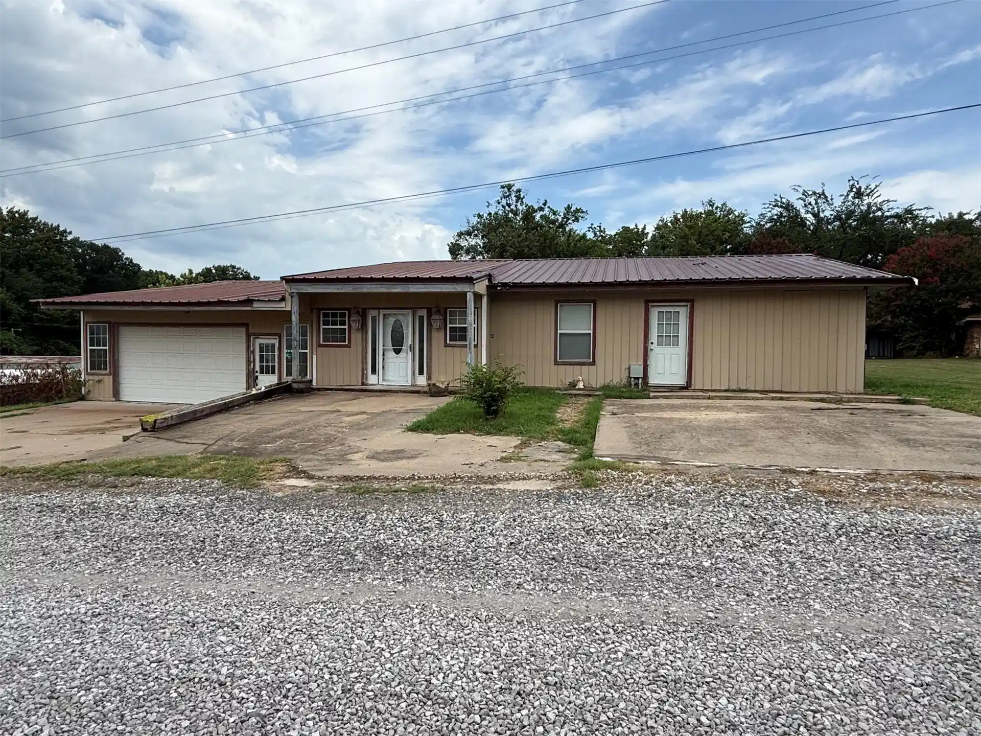 Image 1: Single-story residence featuring a metal-frame con