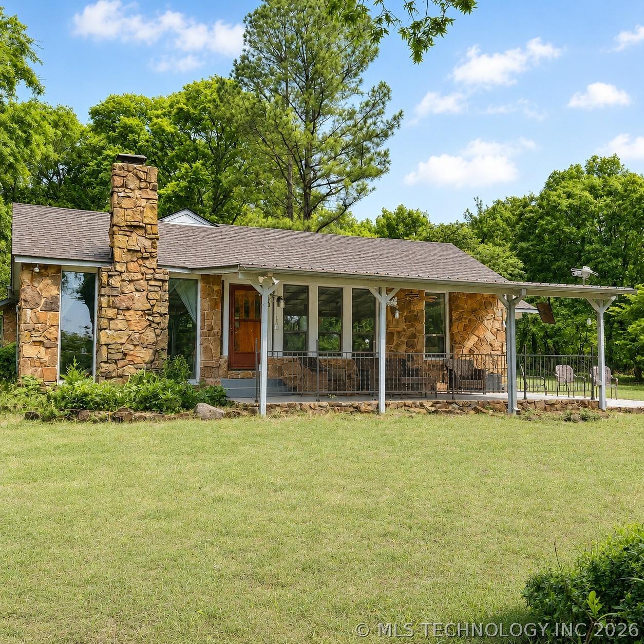 Image 1: Watch the lake view from your covered patio