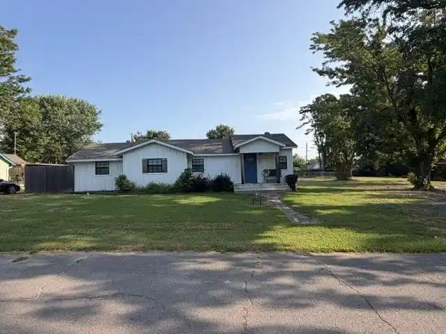 Image 1: White siding home featuring a covered front porch