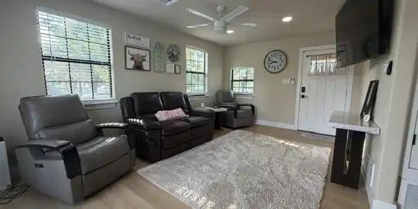 Image 3: Bright living area featuring light wood-finish flo