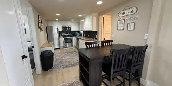Image 4: Open-concept kitchen featuring stainless steel app