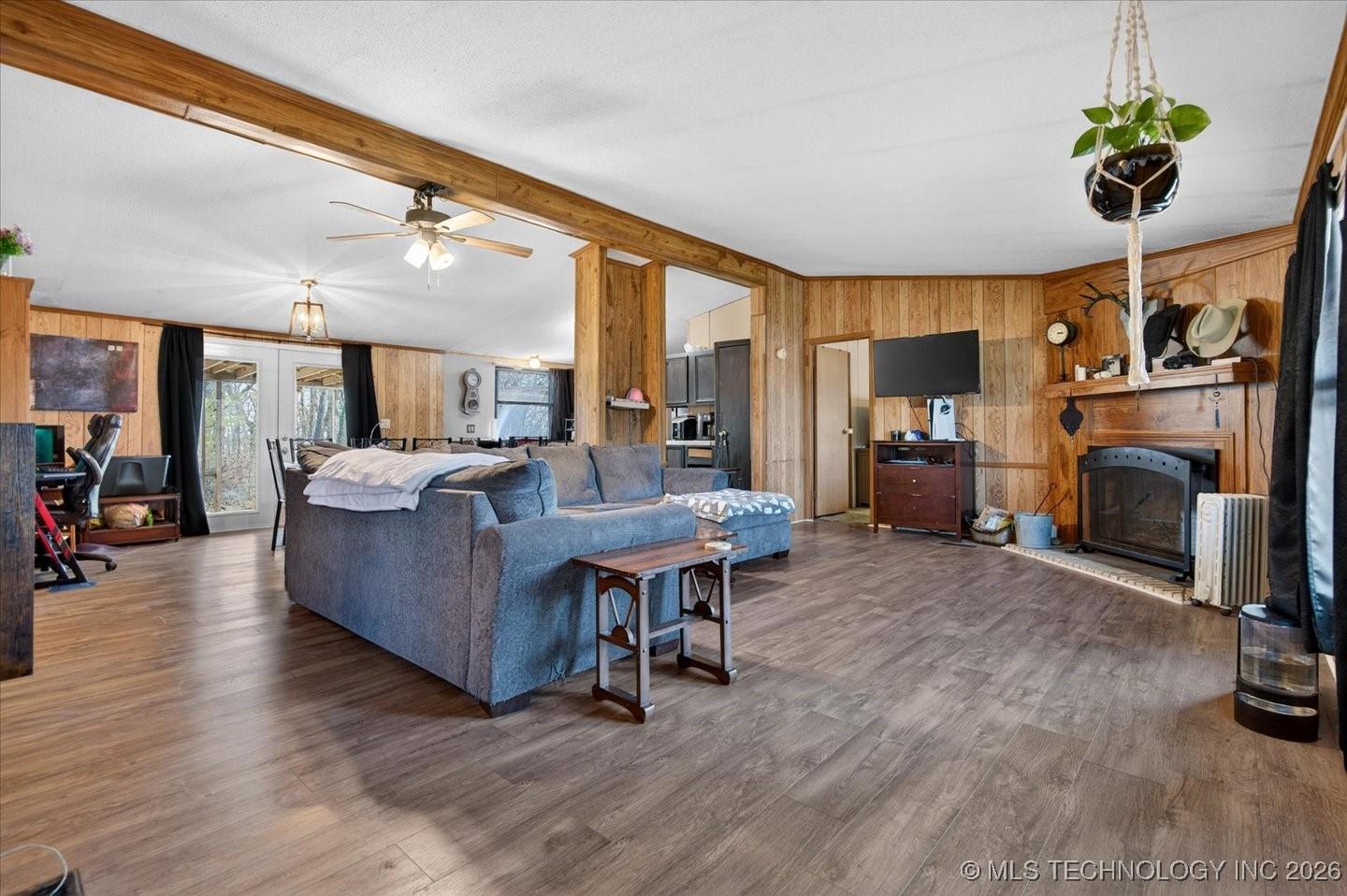 Image 3: Open floor plan with newer wood look laminate floo