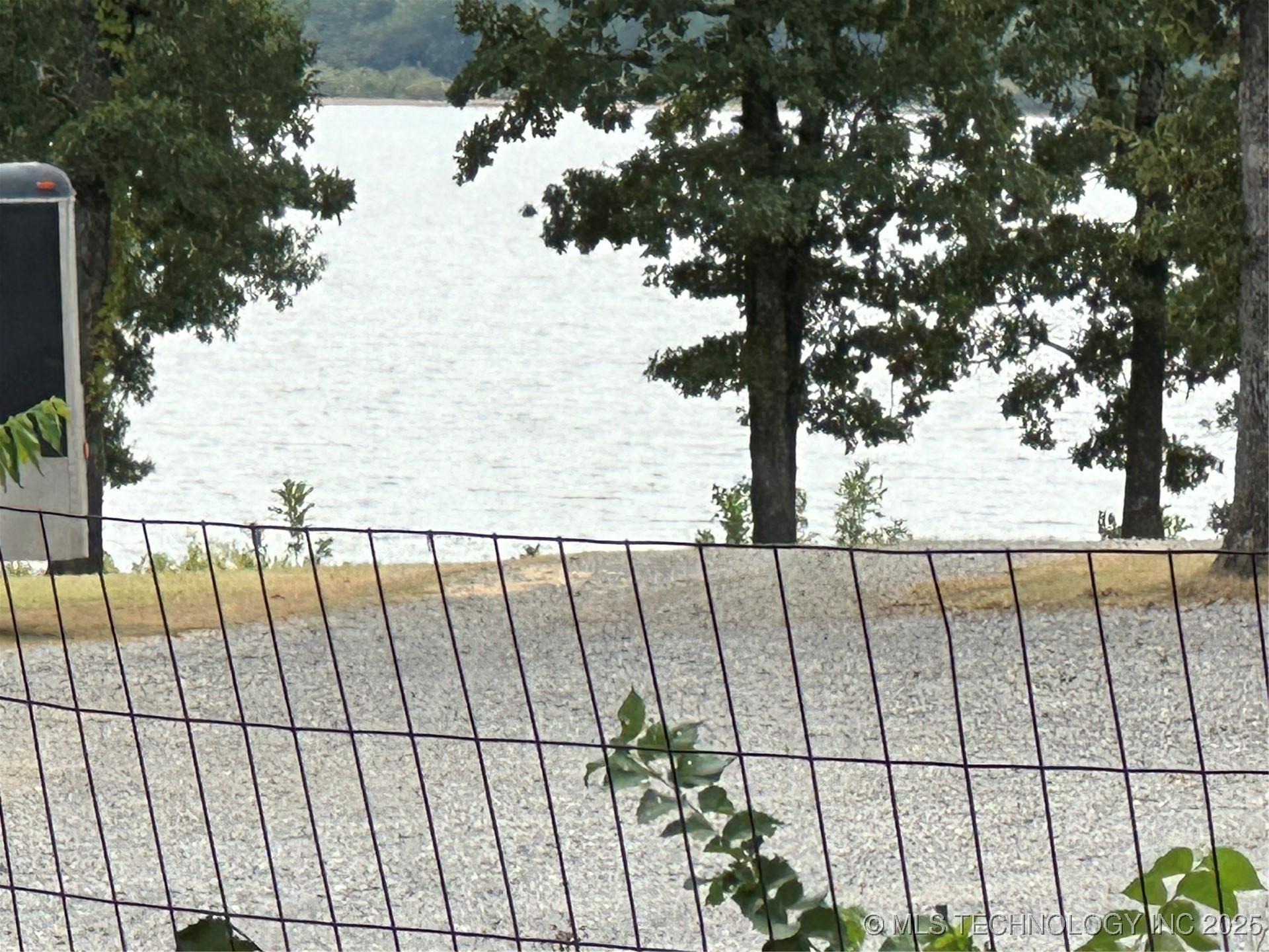 Image 3: THE VIEW OF THE LAKE OUT THE BACK YARD