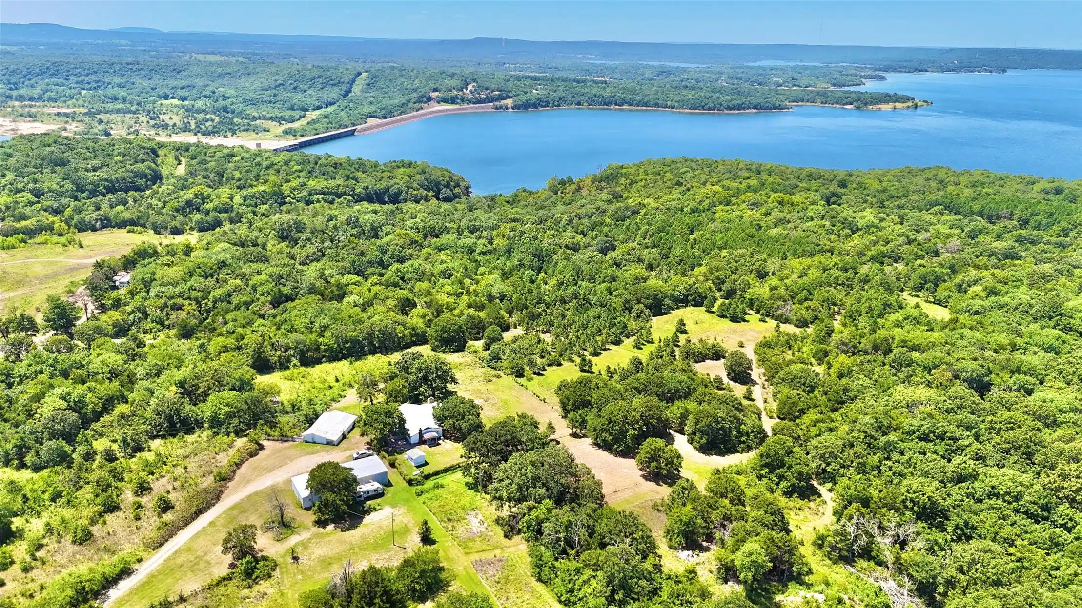 Image 1: Expansive acreage featuring multiple structures, m