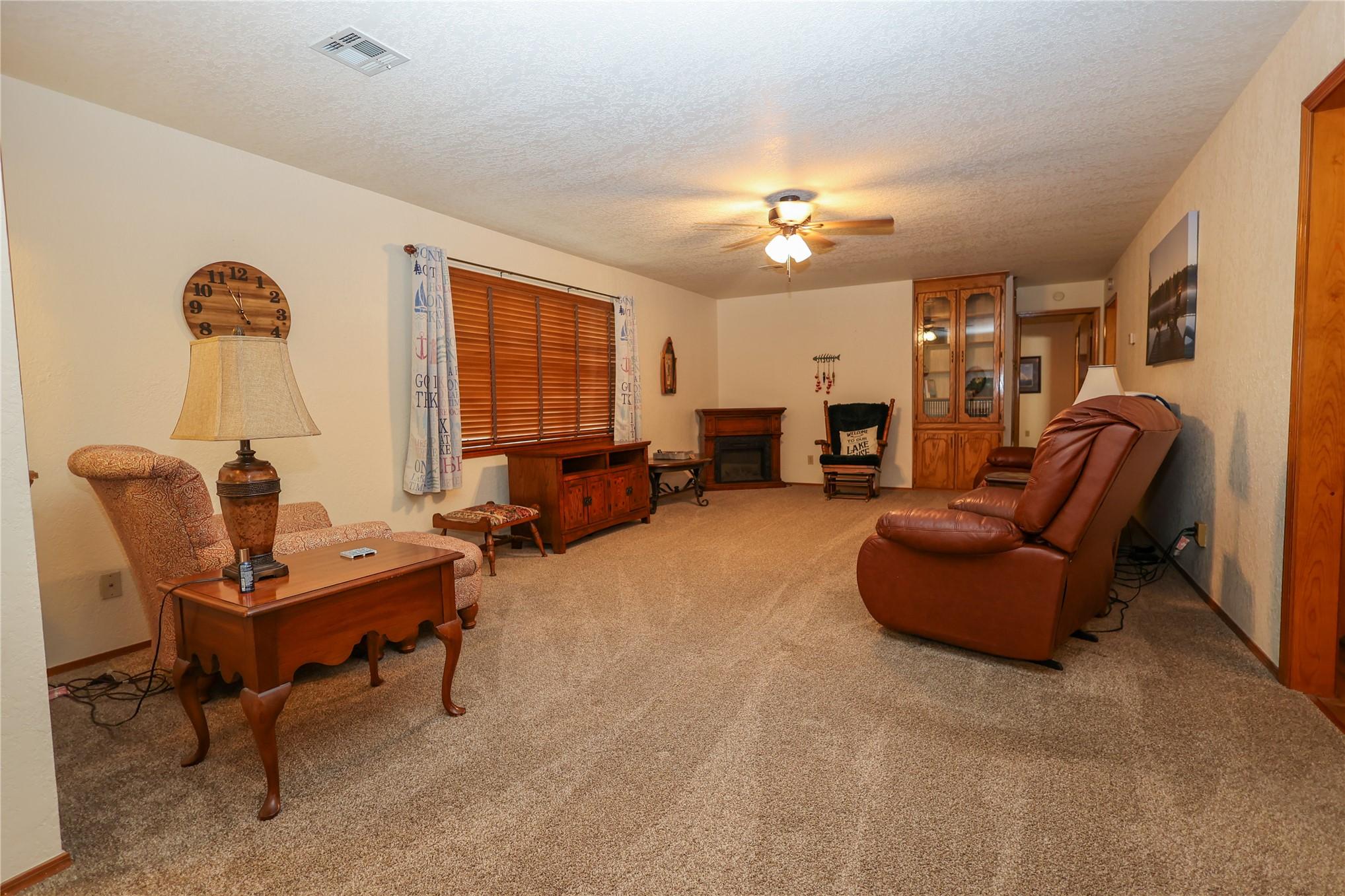 Image 4: Spacious living area featuring neutral carpet floo