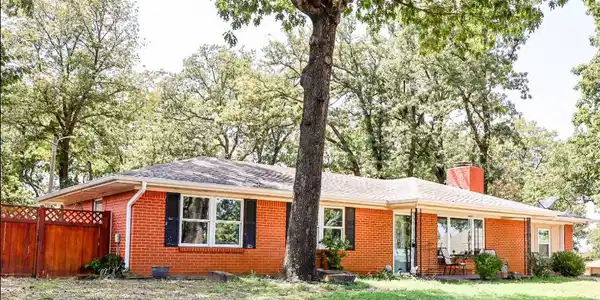 Image 3: Red brick exterior with white trim
