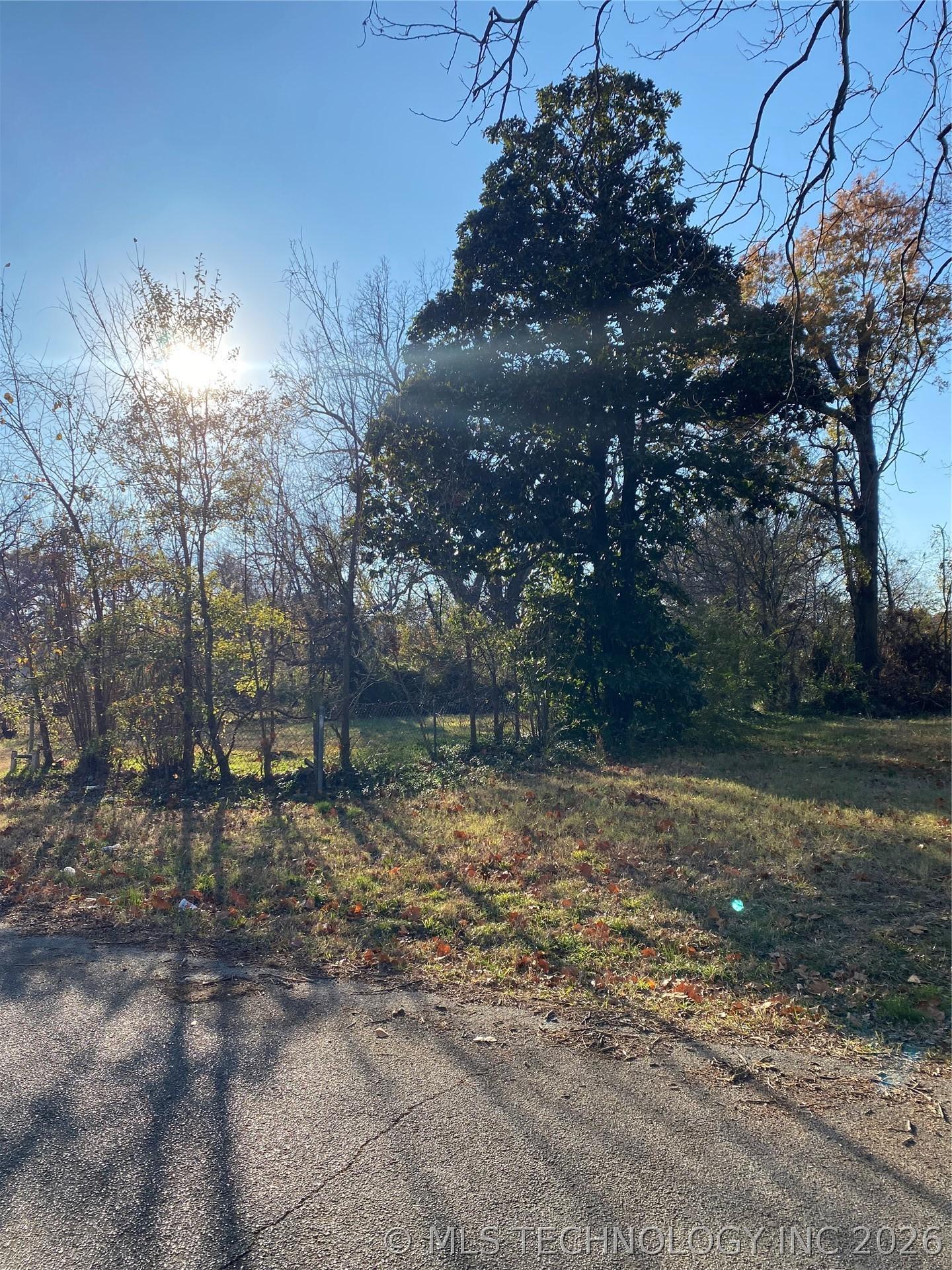Image 3: Southwest view with adjacent vacant lot