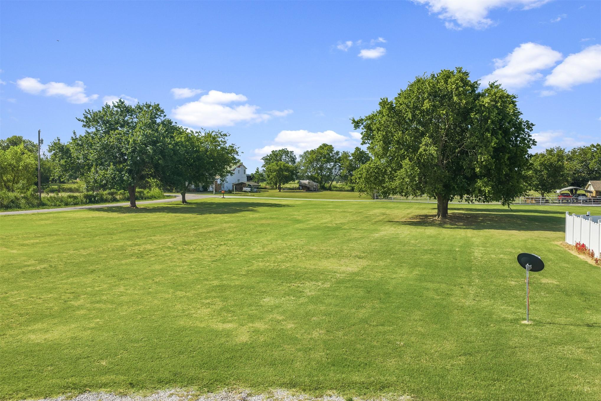 Image 2: Expansive green lawn with mature trees 2.15 acres.