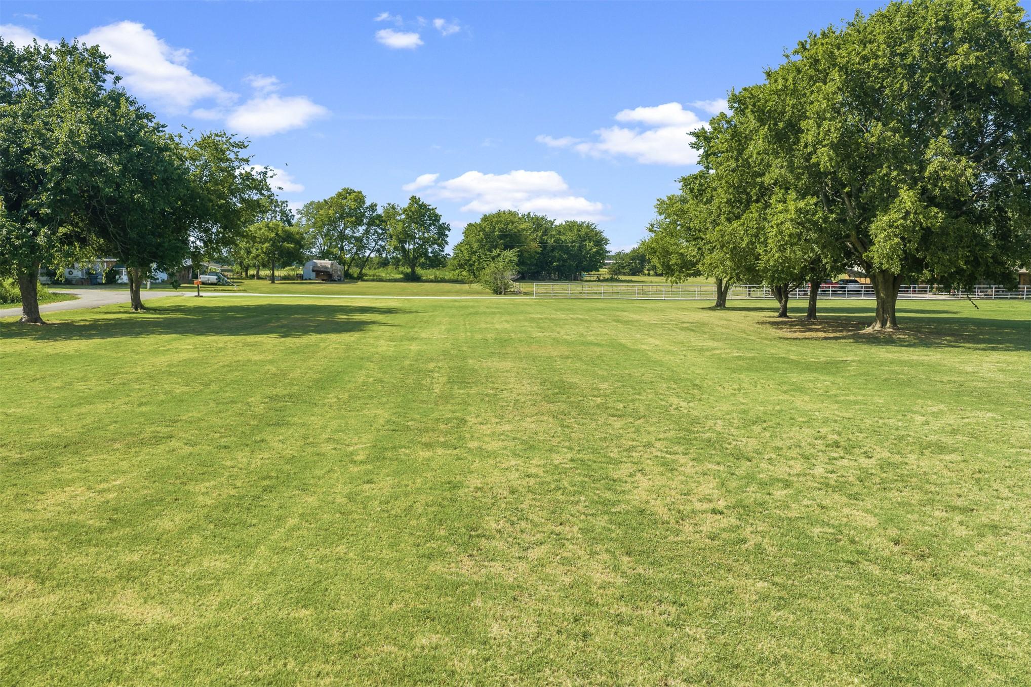 Image 3: Beautiful land welcoming the owner home every day!