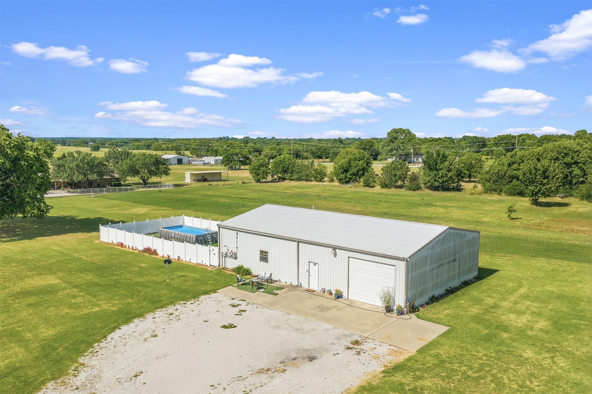 Image 4: A spacious home featuring a corrugated metal roof