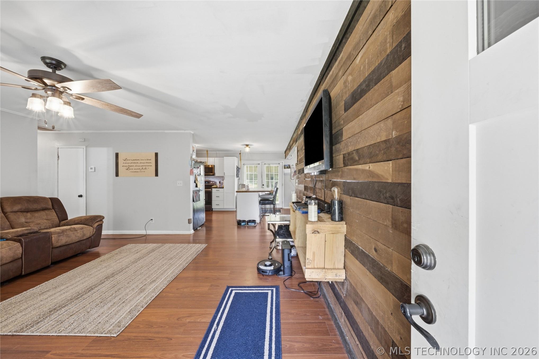 Image 4: Open living room into the kitchen and dining room!