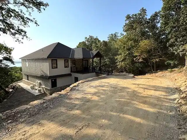 Image 1: Multi-story residence featuring composite shingle