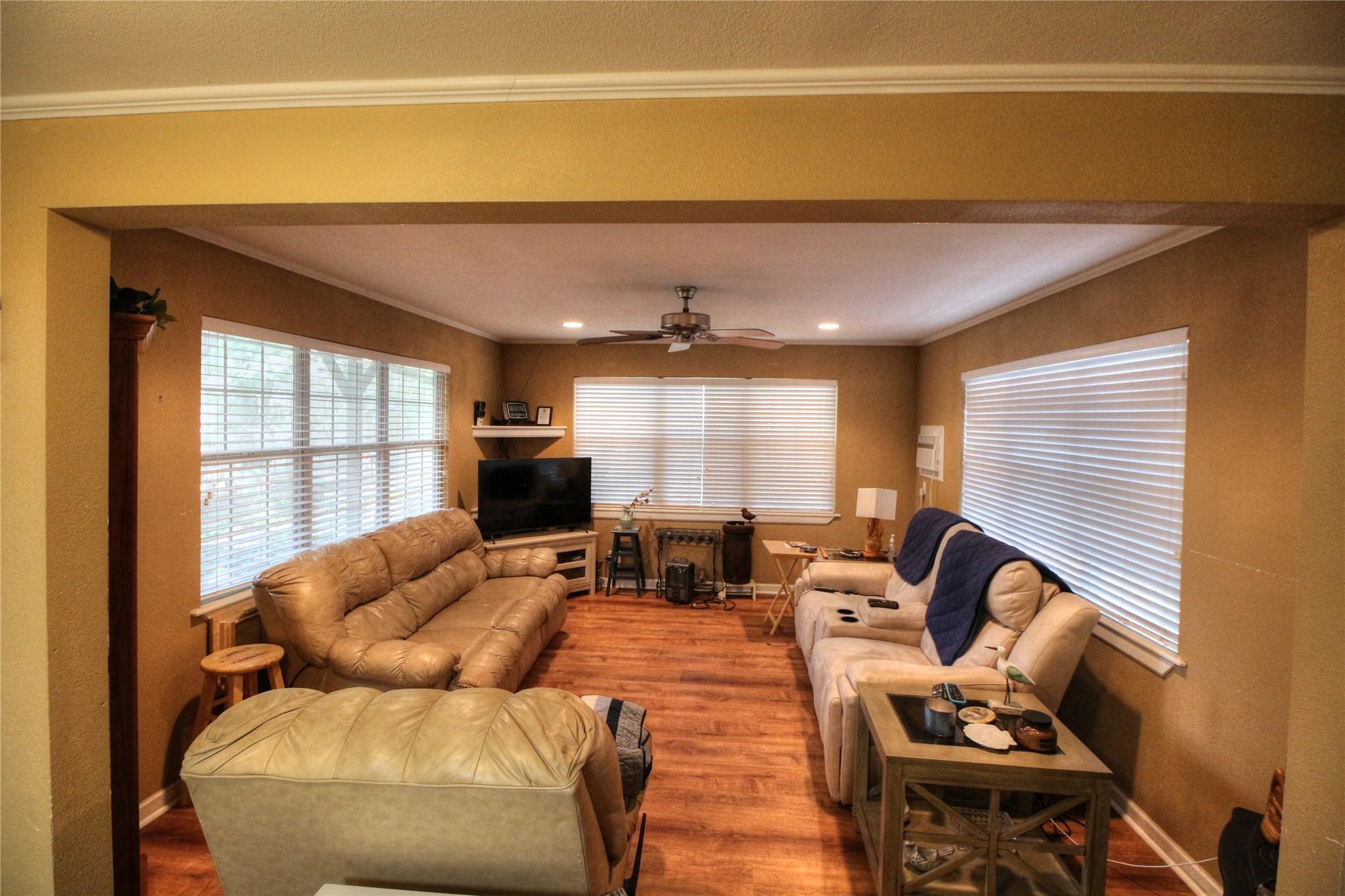 Image 3: Recessed lighting, wood-finish flooring, and crown