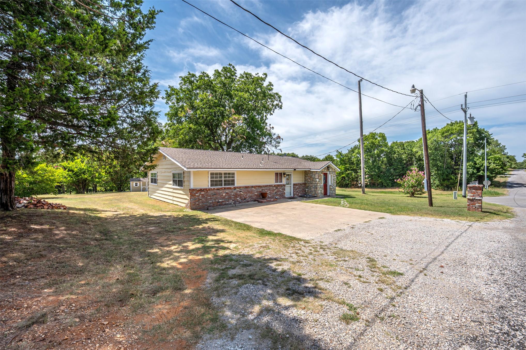 Image 3: Ranch-style residence featuring a combination of b