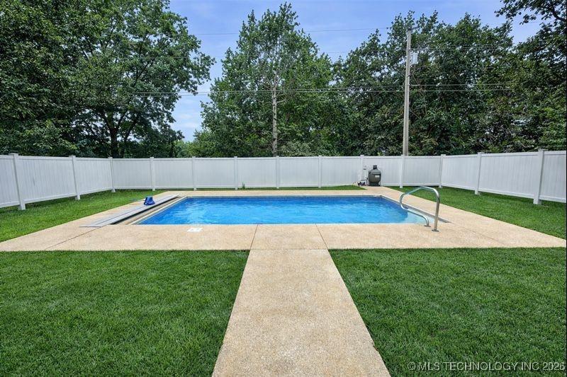 Image 2: Well-maintained inground pool featuring a Automate