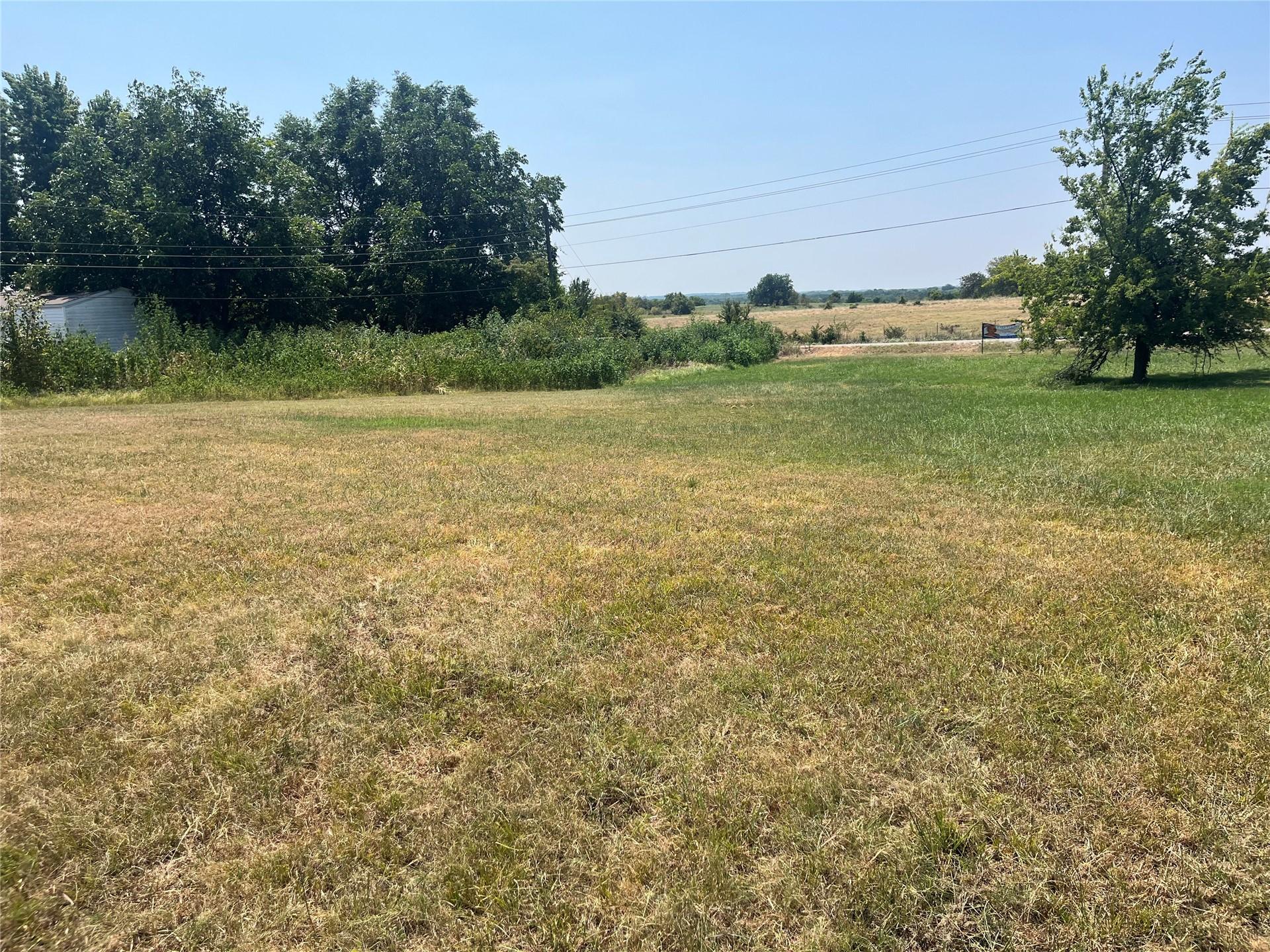 Image 3: Expansive green space featuring a large grassy are