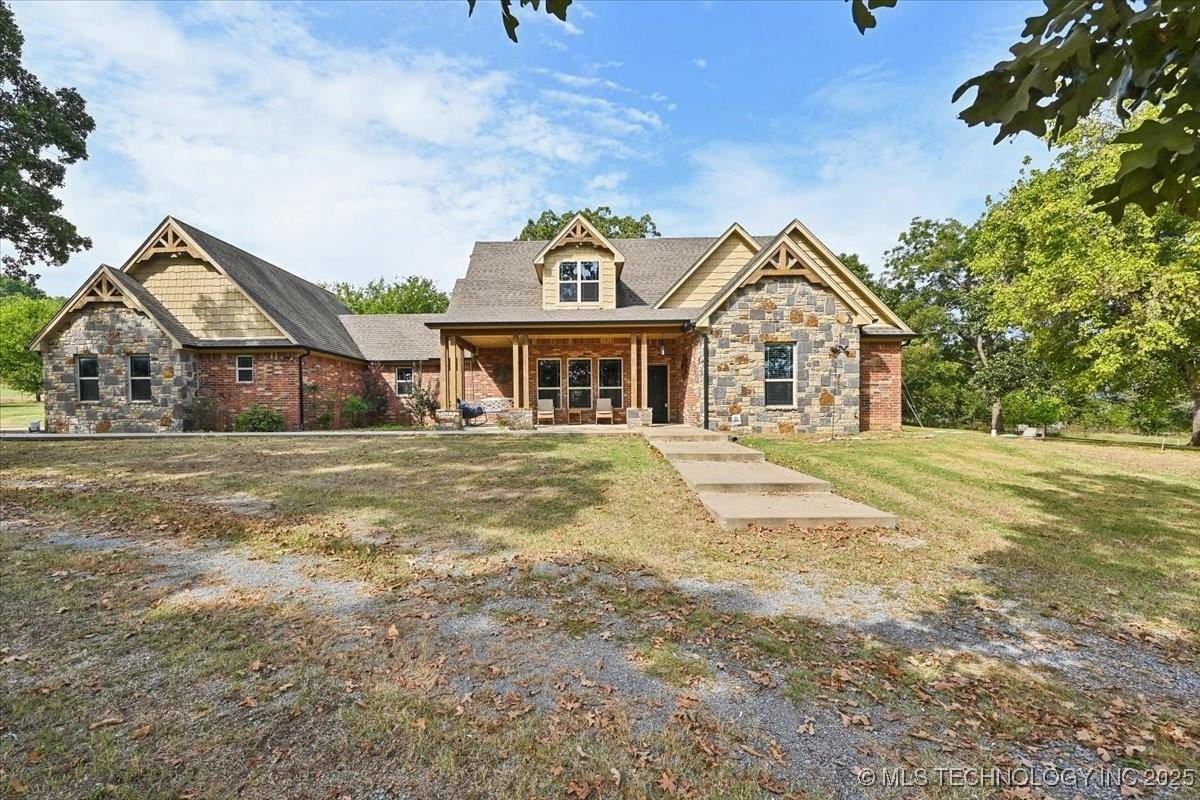 Image 1: Stunning Brick and Rock home with hardie board sid