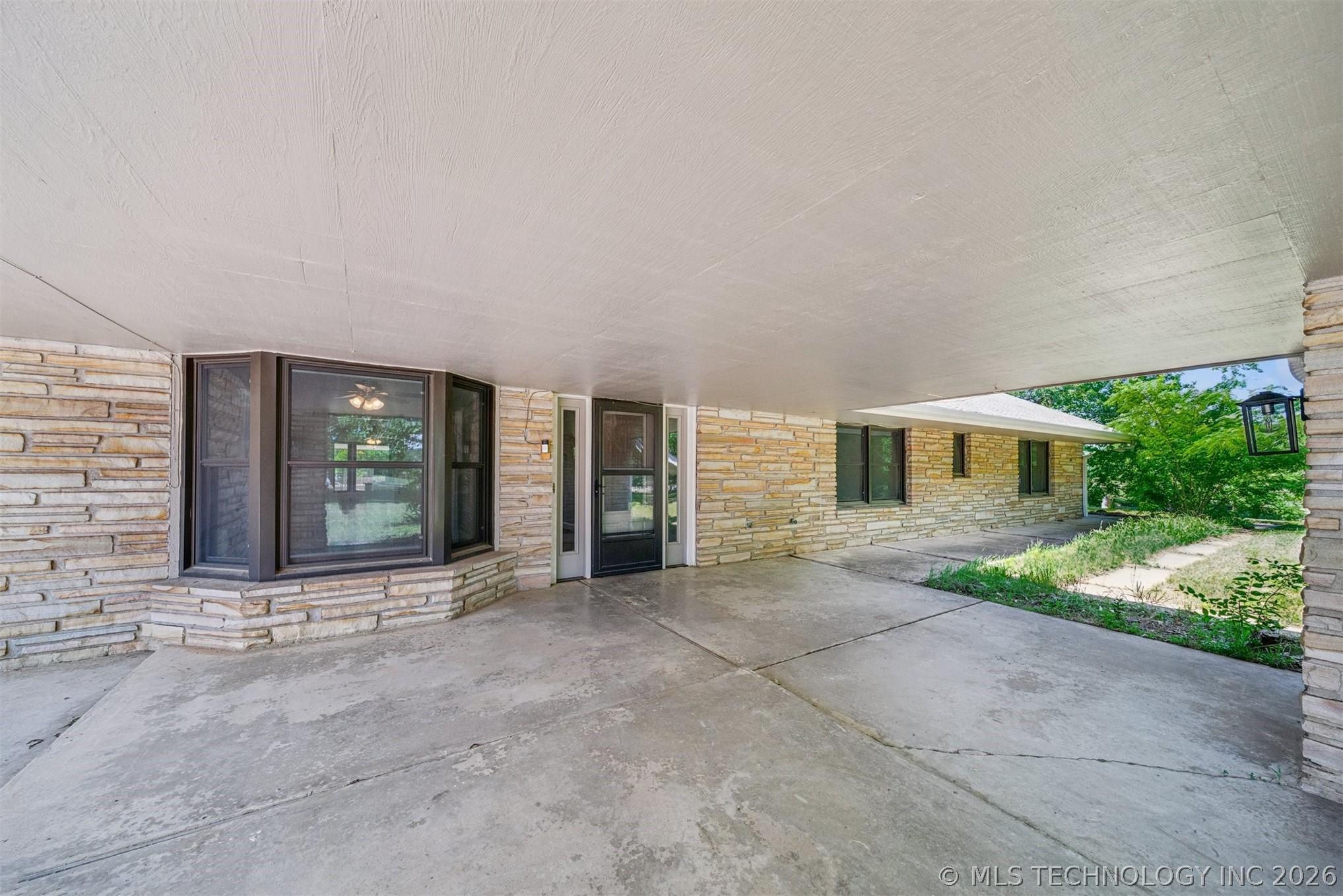 Image 2: Stone veneer exterior featuring an integrated carp