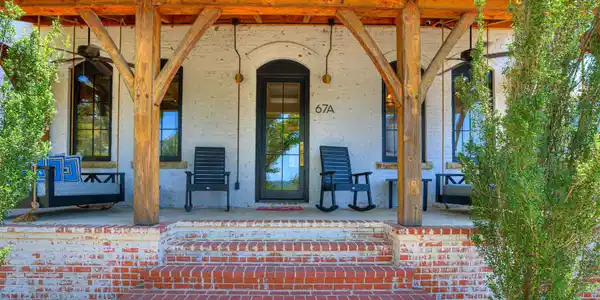 Image 3: Red brick steps with a whitewashed brick foundatio